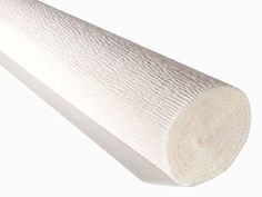 a roll of white paper sitting on top of a table