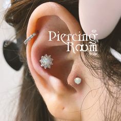 an ear piercing is shown in this advertisement