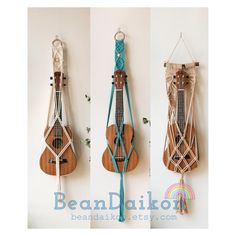 three different types of musical instruments hanging on the wall