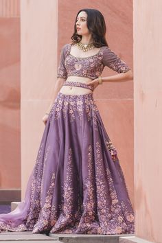 Deep mauve lehenga with attached cancan, highlighted with intricate floral embroidery and sequin embellishments. Comes with cutwork hemline padded blouse, organza dupatta and belt.
Component: 4
Embroidered
Neckline: Round
Sleeve Length: Elbow
Fabric: Lehenga and Blouse: Dupion Silk; Dupatta: Organza
Color: Purple
Resham, gota, dabka, crystals and sequin embroidery
Embroidered blouse with cutwork hemline
Tie-up at the back with latkans
Embroidered dupatta and belt - Aza Fashions Lavender Zari Work Sets For Wedding, Lavender Zari Work Wedding Sets, Lavender Wedding Sets With Zari Work, Lavender Wedding Set With Zari Work, Lavender Lehenga With Zari Work For Wedding, Lavender Wedding Set With Sheer Dupatta, Lavender Sharara With Intricate Embroidery For Wedding, Lavender Sharara With Sheer Dupatta For Wedding, Lavender Anarkali Sets For Receptions