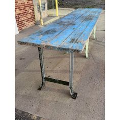 10’ American industrial factory workbench or dining table having butcher block style hardwood maple top, with original hardened square head lag fasteners, and heavy duty pressed and channeled steel tri-pedestal base. Piece is unaltered and is being offered “as found” in original blue factory paint. Believed to have been a machine shop workbench from Wrigley Chewing Gum Factory in Chicago, Illinois, manner of Lyon Metal Products Aurora, Illinois, circa 1940s. Shop Workbench, Aurora Illinois, Shop Work Bench, Industrial Dining Table, Industrial Factory, Industrial Dining, Square Head, Machine Shop, Block Style