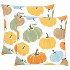 two decorative pillows with pumpkins on them