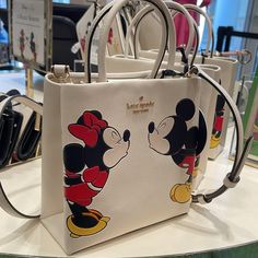 Kate Spade Disney X Kate Spade New York Minnie Mini Tote Parchment Multi Nwt Authentic Style Number Kg591 Measurements Length: 2.96" Height: 7.2" Width: 7.0" Materials Saffiano Pvc Two Way Script Logo Lining Handle Handle Drop:3.5" Strap Strap Drop:22.5" Features Interior Back Zip Pocket Snap Closure Dust Bag Included: No Metal Pinmount With Spade Logo Additional Details Disney X Kate Spade New York Made In Imported Editor's Notes You Know This Tote Holds Your Everyday Stuff Like A Wallet, Keys, Phone, Sunglasses. It Also Holds: Two Red Lipsticks, $6 In Change, 11 Crumpled Receipts, An Avocado Shaker Cards Tutorial, Paw Wallpaper, Cards Tutorial, Kate Spade Purse Pink, Kate Spade Minnie Mouse, Kate Spade Disney, Spade Logo, Luxury Bags Collection, Lv Purse