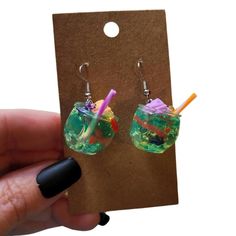 Upcycled mini Halloween bug juice turned earrings! Perfect for your next night out. Stainless steel fish hook earring findings used. Made from resin so they do have a little weight to them. Bug Juice, Halloween Parfait, Fish Hook Earrings, Earring Findings, Fish Hook, Bugs, Jewelry Earrings Dangle, Juice, Night Out