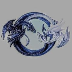 two blue and white dragon sitting in the middle of a circular shape with their heads facing each other