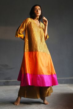 Multi-color A-line flared kurta with colorblock panels and placement hand embroidery.
Component: 1
Embroidered
Neckline: V Neck
Sleeve Length: Three Quarter
Fabric: Handloom Tissue, Silk
Color: Multi Color
Panelled kurta
Note: Dupatta and pant worn by the model is not for sale - Aza Fashions Tissue Kurta, Meenakari Saree, Co Ords Outfits, Gold Suit, Kurta For Women, Simple Kurta Designs, Silk Kurta, Embroidered Neckline, Indian Designer Outfits