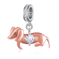 a pink dachshund charm with a crystal beaded on it's side