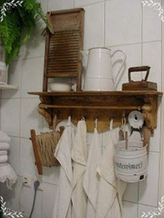 towels hanging on a shelf in a bathroom