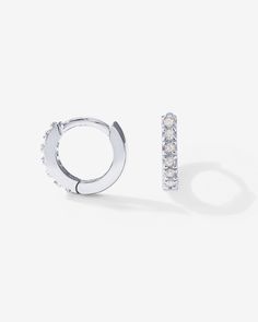 Streamlined and modern, PAVOI Mini CZ Huggies are dazzling and trace the classic shape of hoop earrings. Materials: 14K yellow, rose or white gold plated Measurements: 6mm Inner Diameter, 9mm Outer Diameter; Thickness: 1.5mm