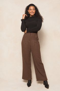 Get ready to strut your stuff in our Tabitha Trousers! Made from a chic houndstooth woven fabric in brown, black, and rust, these ankle length slacks are the perfect addition to any fall wardrobe. With convenient pockets, a secure hook and bar closure, and full lining, these non-stretch slacks offer both style and functionality. Time to step up your fashion game! Brown Tapered Leg Bottoms For Fall, Brown Bottoms For Business Casual In Fall, Brown Office Pants For Fall, Houndstooth Pattern Bottoms For Winter Workwear, Winter Houndstooth Bottoms For Workwear, Brown Bottoms For Fall Workwear, Brown Pants For Workwear In Fall, Fitted Houndstooth Pants For Fall, Brown Houndstooth Bottoms For Workwear