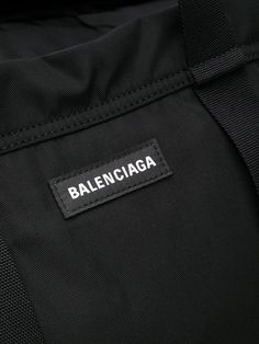 a black bag with the name balenocaga on it's back pocket