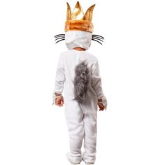 a toddler wearing a cat costume with ears and tail, standing in front of a white background