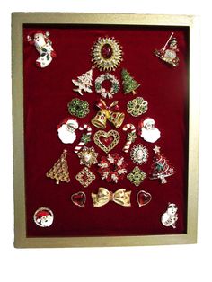 a christmas tree made out of ornaments in a gold frame