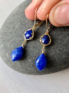 Lapis Lazuli Earrings, Navy Blue Dangle Earrings, September Birthstone, Blue Lapis Earrings in Gold, Earrings for women, Gift for her These Indigo Blue Drop Earrings feature lapis lazuli hexagonal stones framed in 14k gold filled and suspended from them are lapis lazuli teardrops, wire wrapped in 14k Gold Filled. The Earrings are suspended from gold filled lever back ear wires. These are ideal for a night out, they are a great choice for causal wear and they will provide a beautiful pop of color Blue Faceted Drop Jewelry, Elegant Lapis Lazuli Earrings, Blue Faceted Long Drop Jewelry, Blue Lapis Lazuli Jewelry With Ear Wire, Blue Gemstone Crystal Drop Earrings, Blue Nickel-free Linear Earrings For Gift, Blue Dangle Gemstone Jewelry, Blue Gemstone Dangle Jewelry, Blue Gemstone Dangle Earrings