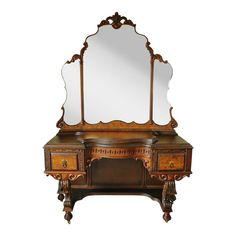 an antique wooden desk with mirror on top