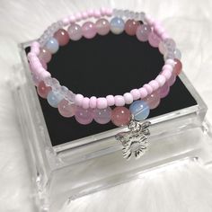 Blush Boutique Beads Bracelet Sets with Glass Beads,  and Gemstone Crystal  Beads,  Glass Seed's Beads, and Silver Charms. Each Charm is Random for Each Bracelet. Adjustable Pink Charm Bracelet With Spacer Beads, Beaded Rose Quartz Crystal Bracelet, Handmade Beaded Bracelets With Rose Quartz, Adjustable Rose Quartz Beaded Bracelet With Round Beads, Pink Beaded Charm Bracelet, Handmade Rose Quartz Beaded Bracelets, Adjustable Pink Gemstone Beaded Bracelets, Pink Gemstone Beads Charm Bracelet, Rose Quartz Faceted Beaded Bracelets