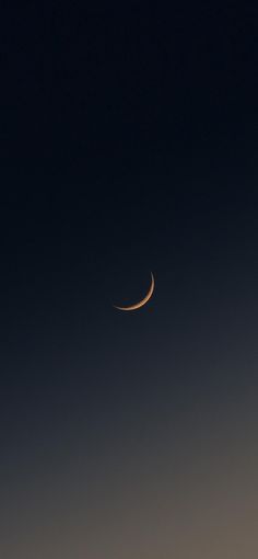 the moon is seen in the dark sky with no clouds on it's side