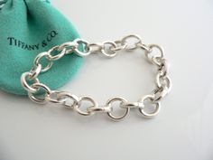 Overview:Offered for sale is a wonderful, super versatile, and gorgeous Tiffany & Co. Sterling Silver Circles Link Charm Clasp Bracelet. Each of the Larger Circle links have a hinge that "opens and closes", allowing you to very easily attach (and remove) charms from each of the links! Super cool piece that only Tiffany can come up with! It is definitely a Tiffany piece that you will get your money's value for. It works perfectly with pretty much any attire your put on, AND is a great stateme Clasp Bracelet, Gift Love, Bracelet Clasps, Enamel Charms, Bracelet Bangle, Weekend Wear, Tiffany Heart, Heart Charm Bracelet, Super Cool