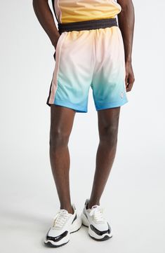 The Parisian label continues to draw inspiration from traditional sporting aesthetics with these football-style shorts boasting a colorful gradient design. 5 1/2" inseam; 26" leg opening; 13 1/4" front rise; 17 1/2" back rise (size Medium) Elastic waist 100% polyester Machine wash, dry flat Made in Portugal Designer Clothing Sporty Multicolor Moisture-wicking Shorts, Sporty Multicolor Athletic Shorts With Built-in Shorts, Multicolor Moisture-wicking Short Bottoms, Color Block Sports Bottoms, Short Length, Multicolor Moisture-wicking Shorts For Athleisure, Sporty Short Color Block Bottoms, Multicolor Moisture-wicking Athleisure Shorts, Multicolor Sporty Shorts With Moisture-wicking, Multicolor Sporty Moisture-wicking Shorts