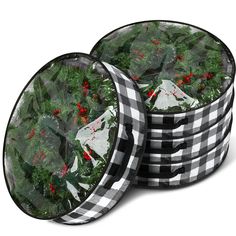 three black and white checkered plates with holly wreaths