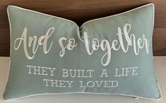 a pillow that says and so together, they built a life they loved on it