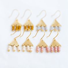 "A lovely pair of little Triangle Brass Earrings. The little earrings measure.5\" long and are made with golden brass triangles and three tiny-beaded bars hanging down. DETAILS Drop: 0.5\" long Metal: Golden Brass Earwires: 24K Gold Plated Three rows of hanging 3mm Czech glass beads Choose: Mustard Light Grey Cream Pink Handmade in our Burlington VT studio Shipped in a gift box" Minimalist Handmade Gold Cartilage Earrings, Gold Minimalist Handmade Cartilage Earrings, Tiny Minimalist Dangle Earrings, Tiny Gold Dangle Cartilage Earrings, Pink Brass Earrings For Gifts, Handmade Minimalist Triangle Earrings, Everyday Gold Triangle Earrings, Handmade Pink Brass Earrings, Pink Brass Dangle Earrings