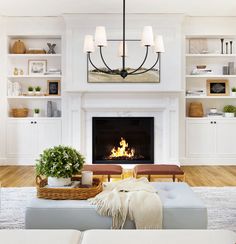 the living room is clean and ready for us to use it's fireplace as a focal point