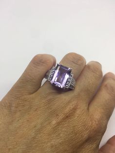 Unusual genuine Amethyst ring set with white sapphire on the sides. Very unusual. Sterling Filigree Setting Handmade size 7.5 can be re sized for you. Sterling Silver is rhodium finished to prevent tarnish All rings are shipped in a nice gift box. Check out our over a THOUSAND great reviews Engraving is $4 per letter and is not always perfect depending on the piece. It can take a few days if the jeweler is busy. This is payable to Paypal Judithsltd@gmail.com Amethyst Jewelry With Accent Stones In Octagon Shape, White Gold Sterling Silver Amethyst Ring With Diamond Accents, Fine Jewelry Octagon Amethyst Ring With Accent Stones, Sterling Silver Amethyst Ring With Diamond Accents For Anniversary, Silver Amethyst Rings With Diamond Accents, Amethyst Ring With Diamond Accents For Anniversary, Silver Emerald Cut Gemstones With Accent Stones, Silver Amethyst Ring With Emerald Cut Accent Stones, White Gold Amethyst Ring With Diamond Accents As Gift