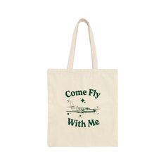 "Our vintage-inspired \"Come Fly With Me\" Airplane Canvas Tote Bag was made for the farmer's market, or your favorite shop around town. This cool and retro-inspired tote is perfect for the stylish jet setter with a love for all things aviation, or pilot! Our tote bag features a retro-style hand-drawn airplane with the groovy saying \"Come Fly With Me\" on a 100% cotton canvas market bag. This aircraft canvas tote bag is not only stylish but also durable, making it the ultimate accessory for you Retro Green Everyday Bag, Green Retro Everyday Bag, Retro Green Pouch Bag, Rectangular Travel Satchel With Letter Print, Retro Satchel Bag As Gift, Retro Travel Shoulder Bag With Letter Print, Retro Shoulder Bag With Letter Print For Travel, Retro Everyday Pouch Bag, Retro Green Bags For Gifts