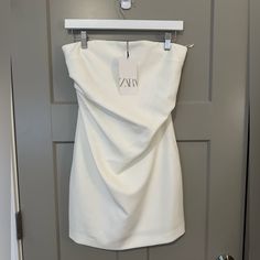 Zara White Mini Dress Size Small Never Worn Zara White Cocktail Dress, Elegant White Strapless Dress For Day Out, Zara White Fitted Sleeveless Dress, Zara Fitted Strapless Mini Dress, Chic Strapless Dress From Zara, Zara Chic Strapless Dress, Fitted Mini Length Strapless Dress By Zara, Chic Strapless Zara Dress, Zara Chic Strapless Mini Dress