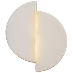 a white circular light fixture on a white background