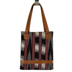 Looking for a uniquely gorgeous structured bag? Look no further! The jaspe (ikat) structured tote is made of handspun and handwoven fabric designed by the women of Ruk’U’X Keem of San Juan La Laguna, Guatemala. Cuero Malec, a Guatemalan leather shop, transforms the fabric into gorgeous, durable bags. Square Woven Bags For Everyday Use, Square Woven Bag For Everyday Use, Artisan Black Handwoven Shoulder Bag, Artisan Handwoven Shoulder Bag For Shopping, Daily Use Tote Shoulder Bag With Weaving Work, Brown Shoulder Bag With Weaving Work For Daily Use, Brown Tote Shoulder Bag With Weaving Work, Brown Travel Bag With Weaving Work, Brown Weaving Work Tote Shoulder Bag