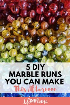 colorful marbles with the words 5 diy marble runs you can make this afternoon