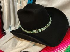 A great statement piece for your cowboy hat.  This handmade cowboy hat hatband is made with turquoise color magnesite, howlite or chalk turquoise beads. Silver color accent beads are added to compliment the color. The chain and s hook closure make it adjustable.  Just a little added touch with a lucky horseshoe charm.  Beaded length: 21" (with conchos) Chain: 7" FREE SHIPPING Thank you for shopping KactusKatsBoutique 🌵 Favor my shop to get notices of new items Watch for cowboy boot Christmas stockings Western Style Blue Beaded Turquoise Necklace, Adjustable Turquoise Hat Bands For Country Events, Adjustable Turquoise Hat Bands For Festivals, Adjustable Southwestern Turquoise Hat Bands, Adjustable Beaded Rustic Turquoise Necklace, Western Blue Jewelry For The Beach, Western Style Adjustable Beaded Jewelry, Handmade Turquoise Bohemian Hat Band, Handmade Western Beach Jewelry