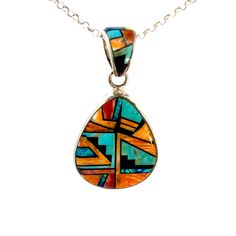 Vintage Southwestern Sterling Silver Inlay Pendant: This inlay pendant features a combination of Turquoise, Black Onyx and Spiny Oyster, beautifully handcrafted with expert attention to detail. Immerse yourself in true Southwestern style with this exceptional addition to any collection. Stones: Turquoise, Onyx, Spiny Oyster, Lapis Setting: 1".25 L x 1"W (bottom) Size: 2" L w/bail (a tad under 2") Metal: Sterling Silver Weight: 12.9 Grams Includes 16" SS Rolo Chain This listing is for (1) Pendant only Explore our curated selection of Vintage Pendants + Necklaces here. Discover the entire 'Silver Raven' Vintage Collection for yourself. Multicolor Inlay Southwestern Necklace, Unique Sterling Silver Turquoise Inlay Necklace, Southwestern Turquoise Inlay Pendant Necklace, Artisan Turquoise Pendant Necklace With Inlay, Southwestern Sterling Silver Inlay Necklace, Southwestern Sterling Silver Inlay Necklaces, Southwestern Sterling Silver Necklace With Inlay, Southwestern Style Multicolor Turquoise Pendant Necklace, Multicolor Southwestern Turquoise Pendant Necklace