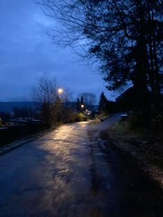 an empty road at night with no cars on it