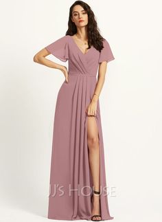 a woman in a long purple dress with a slit down the side and short sleeves