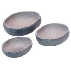 three gray bowls sitting next to each other