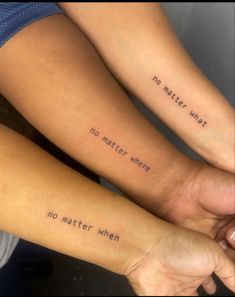 two people with tattoos on their arms that say no matter what they want to do