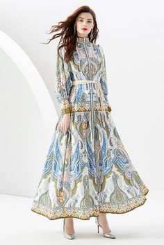 This blue paisley maxi dress from You Spin Me Around is perfect for party or festive occasions. It features a stand collar with puff long sleeves and a flowy silhouette for a timeless look. Its vintage-inspired pattern is sure to make you stand out in any crowd. SIZE GUIDE (CM) Size Bust Waist Sleeve Shoulder Length S 106 110 59 36 135 M 110 114 60 37 136 L 114 118 65 38 137 XL 118 122 66 39 138 XXL 122 126 67 40 139 Spring Party Maxi Dress With Paisley Print, Spring Party Paisley Print Maxi Dress, Billowy Lantern Sleeve Maxi Dress For Spring, Billowy Long Sleeve Floral Maxi Dress, Flowy Long Sleeve Dresses With Paisley Print, Flowy Blue Maxi Dress With Paisley Print, Blue Paisley Print Flowy Maxi Dress, Flowy Blue Paisley Print Maxi Dress, Spring Paisley Print Maxi Dress