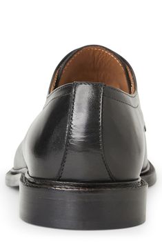 This cap-toe derby is cut from premium Italian leather. Lace-up style Leather upper and lining/leather and rubber sole Made in Italy Goodyear Welted Snip Toe Oxfords For Business Casual, Cap Toe Oxfords With Leather Sole, Masculine Cap Toe Oxfords With Leather Sole, Masculine Cap Toe Dress Shoes With Goodyear Welt, Cap Toe Leather Shoes With Rubber Sole, Masculine Cap Toe Oxfords With Rubber Sole, Business Cap Toe Leather Shoes With Rubber Heel Cap, Business Leather Cap Toe Shoes With Rubber Heel Cap, Classic Cap Toe Lace-up Shoes In Calf Leather