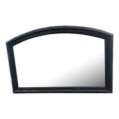 a mirror that is sitting on top of a table with a black frame around it