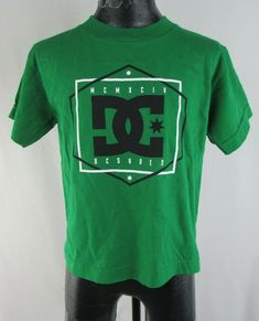 DC Shoes Kid's Green T-Shirt Description: DC Shoes Unisex Kid's Short-Sleeve T-Shirt Color: Green Available Sizes: 5/M Measurements:  Armpit-to-Armpit: 14", Length: 17" Material: 100% Cotton The item is BRAND NEW with tags Shipping and Handling: FREE within the United States Expedited Shipping Available Items packed and shipped within 1 business day of purchase. (Excludes Holidays & Weekends) Payment Methods: Sales Tax: Customers with a NY shipping address must add sales tax on the complete tota Casual Green T-shirt With Logo, Green Cotton T-shirt With Logo Print, Green Cotton T-shirt With Logo, Green Casual Logo T-shirt, Green Graphic Tee With Logo, Casual Green Logo T-shirt, Green Casual T-shirt With Logo, Basic Green T-shirt With Logo Print, Green Branded T-shirt For Streetwear