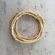 These bestselling bracelets look gorgeous in a single colour, or really stunning stacked with the silver, gold and rose gold version.   Normal price for 4=32, so save £6 on this 4-bracelet deal!Permanent gold finish Japanese glass seed beads.  I have tested these beads vigorously, building sandcastles on the beach.  The finish does not wear off!As with all items, thiese bracelets are delivered in a luxurious gift box finished with grosgrain ribbon. If you are ordering a gift, please leave a note Luxury Single Strand Beaded Bracelets, Luxury Single Strand Brown Necklace, Stretch Beaded Bracelets Diy, Bracelets Stack, Beads Craft Jewelry, Bracelet Stacks, Glass Bead Bracelet, Circle Earrings Studs, Moonstone Bracelet