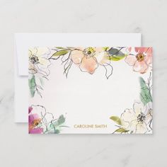 a card with watercolor flowers on it