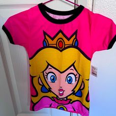 Small Princess Peach T-Shirt Size Small For Girls. Super Cute Bought It At Universal For My Daughter But It’s Too Small For Her. Thanks For Checking Out My Closet. Cute Multicolor T-shirt For Playwear, Playful Pink Short Sleeve T-shirt, Cute Pink T-shirt With Cartoon Print, Cute Character Print T-shirt For Playwear, Pink Cartoon Print Short Sleeve Tops, Playful Pink Cartoon Print Top, Pink Short Sleeve Tops With Cartoon Print, Crew Neck T-shirt With Cartoon Print For Playwear, Crew Neck T-shirt With Cartoon Print For Play