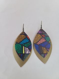 This product is a 3-inch, colorful tribal pattern on a shiny brown earring with antique gold hooks. Great for a gift! Comes from a smoke free home. Shipping is around 2-3 days, but usually ships more quickly.   Please ensure your address is correct before purchasing. We will ship to the address provided at checkout and we are not responsible for products shipped to the wrong address. Thank you! Artsy Multicolor Nickel Free Earrings, Nickel-free Multicolor Artsy Earrings, Artsy Multicolor Nickel-free Earrings, Artsy Brown Drop Earrings, Brown Artsy Earrings, Brown Dangle Earrings With Artsy Style, Hand Painted Multicolor Earrings For Party, Multicolor Hand Painted Drop Earrings, Artsy Brown Earrings With Ear Wire