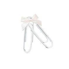 a pair of paper clips with a bow on it's end and two pins attached to them