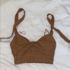 Brown Crop Top With Tie Straps New Chic Vacation Tops With Knotted Straps, Cotton Crop Top With Tie Straps For Vacation, Chic Tops With Knotted Straps For Vacation, Casual Cropped Top With Knotted Straps, Casual Cropped Tops With Knotted Straps, Casual Cotton Crop Top With Tie Straps, Casual Summer Crop Top With Tie Straps, Casual Crop Top With Tie Straps For Vacation, Chic Summer Crop Top With Knotted Straps