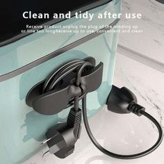 an electric charger plugged into the side of a counter with text that reads, clean and tidy after use